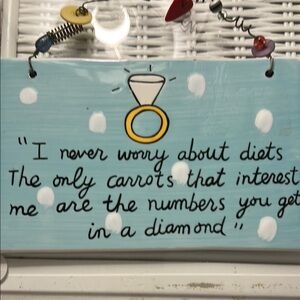 Whimsical Blue Sign with Diamond Ring Design